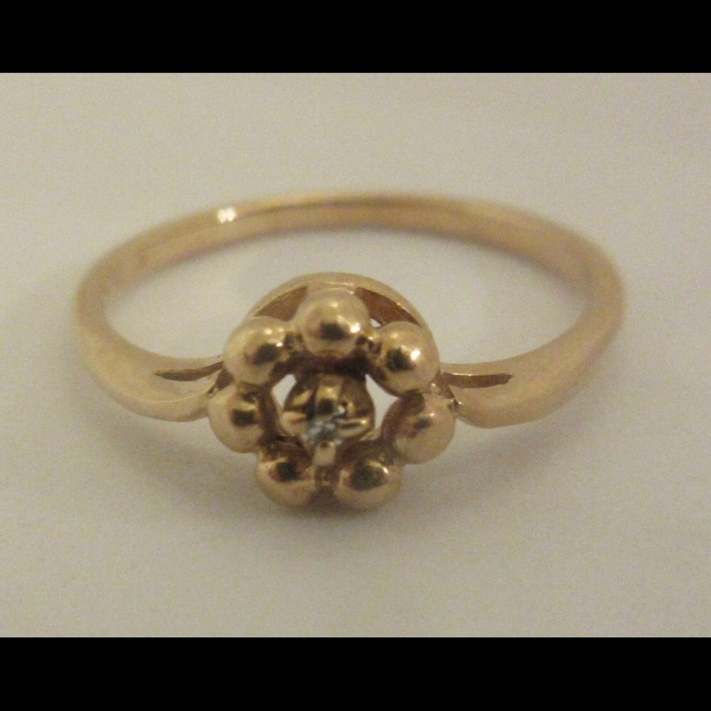 Dainty 14k yellow gold ring with tiny diamond